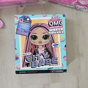 L.O.L. Surprise! OMG World Travel Doll with Pink and Black Hair
